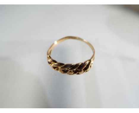 A 15ct gold 5.5 mm wide keeper knot ring, on a plain half hoop shank, stamped 15 ct, size L and a half, approx weight 2.02 gr