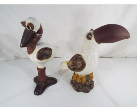 Two Grotesque Fantasy ceramic birds one depicting a Toucan with three toes approx 28cm (h) and the other in the form of a lon