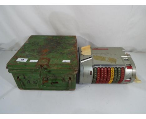 A vintage Almex ticket machine in metal case.