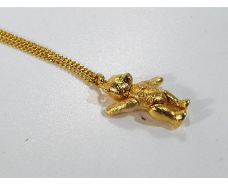 Steiff - a gilded Steiff teddy bear pendant on gilded necklace by Steiff Teddy Anbanger mit Aette in original Steiff Boutique