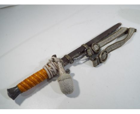 A Nazi officer's Army (Heer) Dagger marked to the blade WKC solingen  with Portepee and Hanger, 25 cm blade, overall length 3
