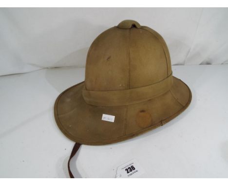 A British Army Foreign Service Tropical Pith Helmet in Khaki - NOTE: Please read 'Important Information' contained in LOT 161