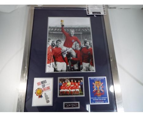A good quality framed print depicting the 1966 world cup winners England versus West Germany, bearing the signatures of Geoff