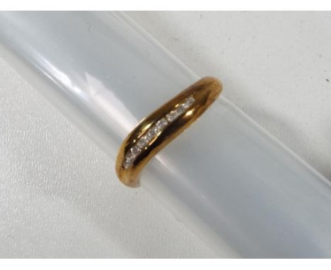 A lady's 9 carat gold 10 pt diamond channel set ring, size K + 1/2, 1.4 gm (all in) unused surplus retail stock - Est £20 - £