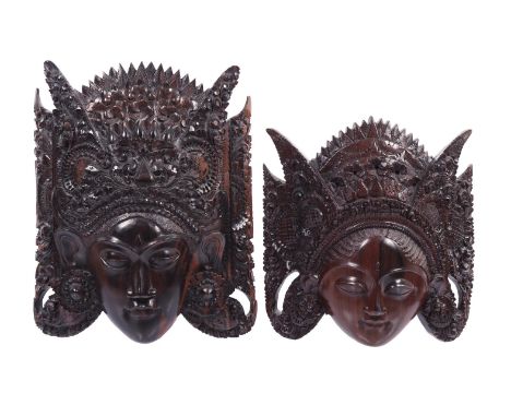 2 richly decorated wooden masks of ladies, Bali, ca. 1920, 27x26 cm and 33x27 cm