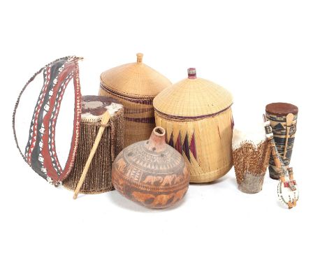 Lot of African items including tam-tams, largest 38 cm high, 30 cm diameter, string instrument, 38 cm long, 2 woven wicker ba