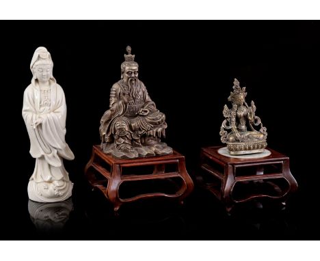 Blanc de chine porcelain Guanyin, 28 cm high (2 fingers broken), bronze statue of a Buddha, metal statue of a philosopher and