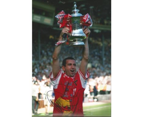 Football Nigel Winterburn signed 12x8 colour photo pictured lifting the FA Cup while playing for Arsenal. Good Condition. All