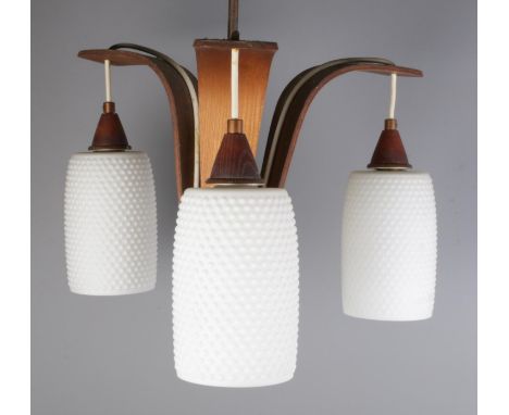 A retro teak three branch ceiling light with white glass shades.  One shade with damage.