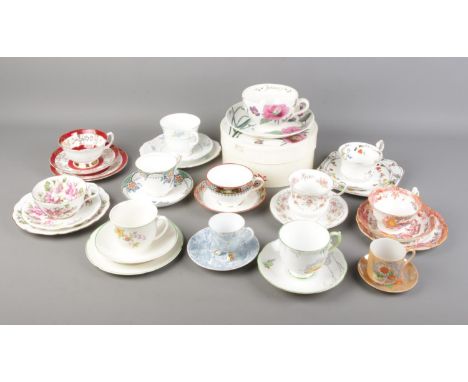 A collection of bone china cups and saucers and trios. Includes Spode, Roslyn, Royal Grafton, Grindley etc.