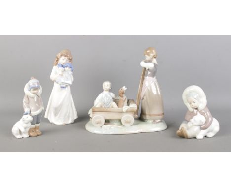 A collection of Lladro and NAO by Lladro figures, including 1245 'Girl Pulling Wagon' and 1195 Eskimo.