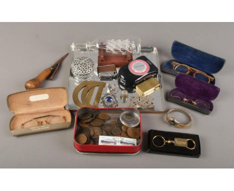 A tray of collectables. Includes vintage spectacles, pre decimal coins, Zippo lighter, glass ship in a bottle etc.