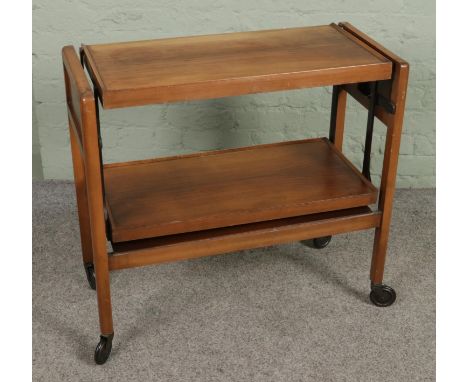A mid-century 'Tri-Magic' metamorphic drinks trolley and table, on casters.