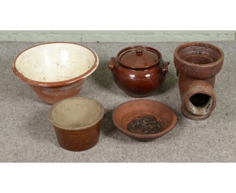 A collection of assorted stoneware to include large pancheon, twin handled lidded jar, gully trap/planter, etc.