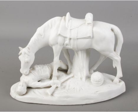A bisque figure group of a wounded soldier beside his horse. Height 13cm.  Small chip to ear of horse. Top of helmet missing.