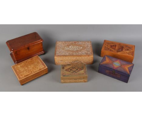 A collection of wooden jewellery and trinket boxes. Including carved and inlaid examples.