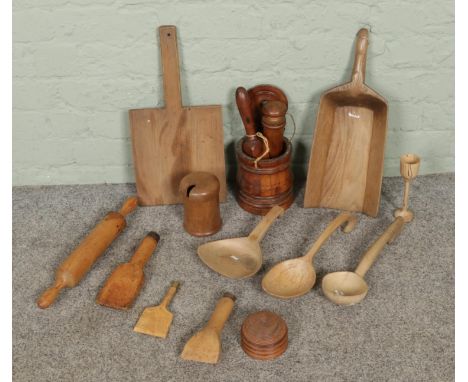 A group of vintage treen, comprising of beech wood paddle handled board, ash scoop, hook-ended ladle, mortar and pestle and l