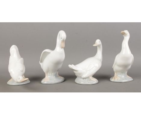 Four NAO by Lladro ceramic geese.