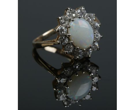 A 9ct gold, opal and paste ring. Size J 1/2. 2.1g.