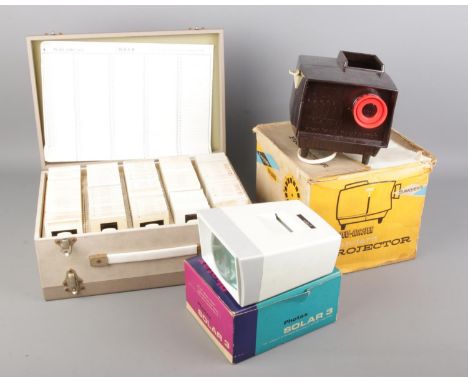 A View-Master Standard Projector with a Photax Solar 3 and a case full of slides.