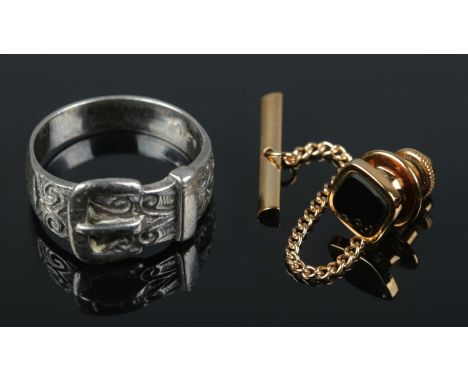 A 9ct gold tie tack pin with a silver belt shaped ring