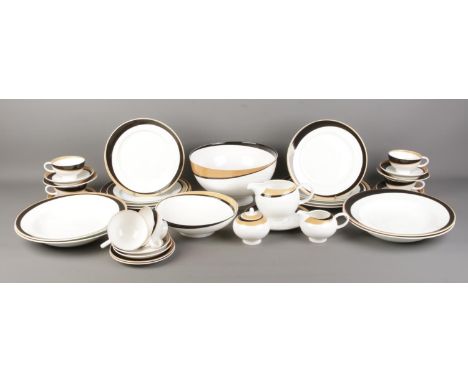 A collection of Royal Doulton Julien Macdonald 'Temptaion' dinnerwares. To include large salad bowl, plates, cups, saucers an