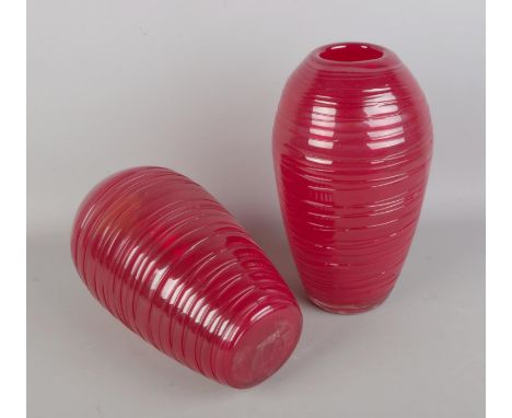 A pair of clear hand-blown ruby art glass ornamental vases with a threaded body design in the style of Fulvio Bianconi.  Heig