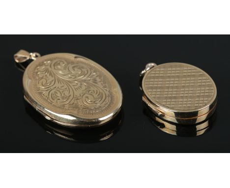 Two 9ct Gold hinged locket pendants, one with engine turned decoration, the other with scrolled detailing. Largest 3.5cm long
