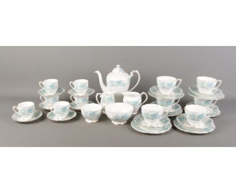 A Rosyln China tea service in the 'Remember Me' pattern. Containing teapot, tea and coffee cups and saucers, sugar bowl and c