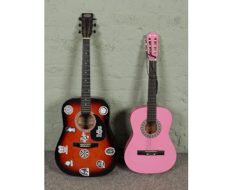Two acoustic guitars; by Stagg and Elevation.  One string snapped on Stagg.