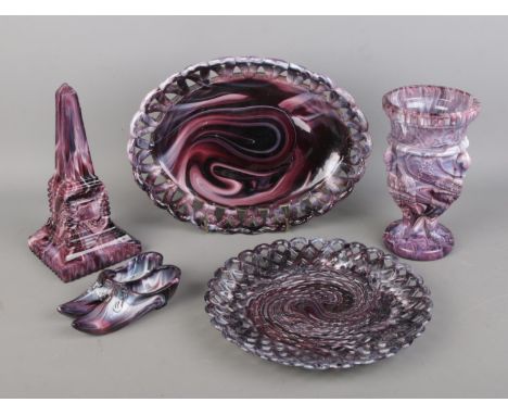 A group of five purple Malachite Slag glass items, featuring a basket weave plate, an oval flower dish, an urn-shaped vase, a