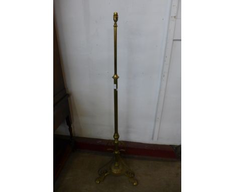 An Arts and Crafts brass telescopic floor standard lamp 