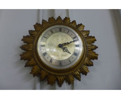 A gilt sunburst clock 