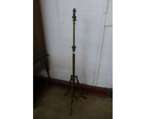 An Arts and Crafts brass and copper floor standing lamp 