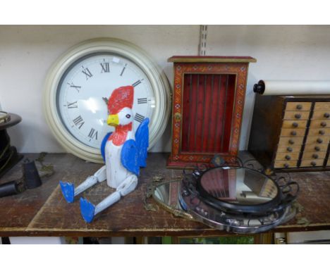 A Chinese red painted key cabinet, three mirrors, wall clock and a painted wooden cockerel 
