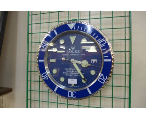 A Rolex style dealer's circular wall clock 