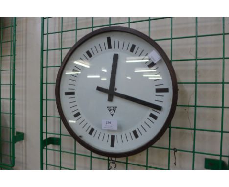 An Eastern European circular factory wall clock 