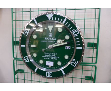 A Rolex style dealer's circular wall clock 