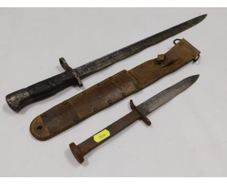 A 1913 British pattern Remington bayonet, 21.625in long twinned with a WW2 US M3-U.C.-1943 dagger with leather scabbard, hand