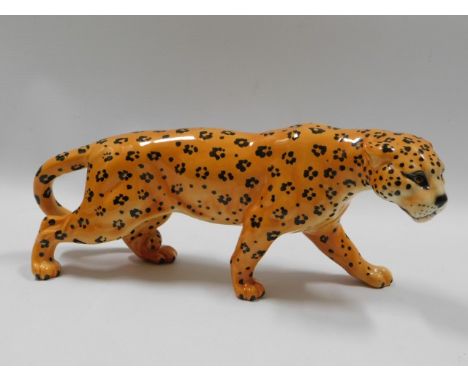 A vintage Beswick pottery leopard, 11.5in long x 4.25in high