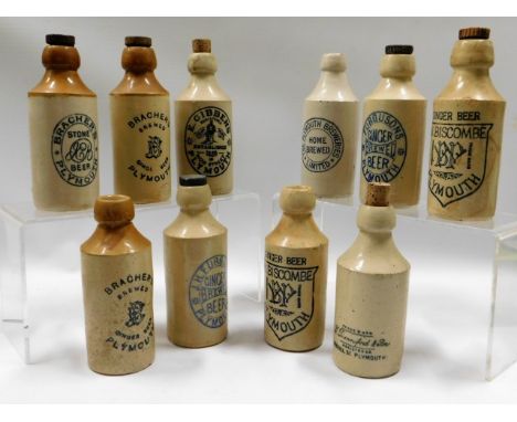 A selection of ten vintage stoneware ginger beer bottles including Biscombe, Furgusons, Brachers &amp; Gibbens, one cracked
