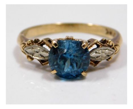 A 14ct gold ring set with zircon &amp; 10ct mounted diamond, zircon measures 6.25mm in diameter &amp; has chip to edge, size 