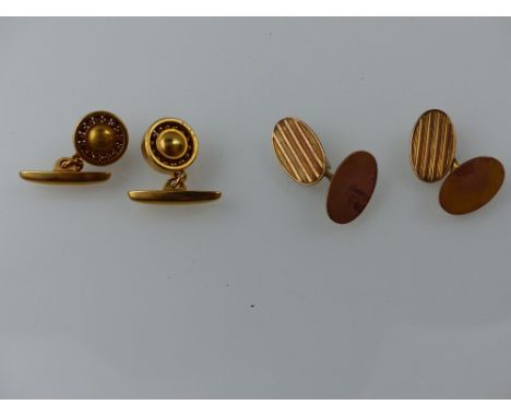 A pair of engine turned 9ct chain cufflinks, together with a pair of gold plated cufflinks modelled as bearings. 