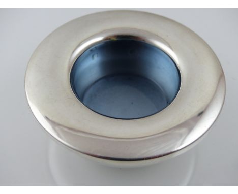 A silver candle holder, Birmingham 2004, of low dish form with a grey enamel interior, 6.5ozt