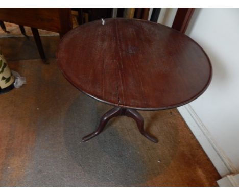 A George III mahogany tea table, the dished circular tilt top with bird cage, raised on turned pillar and cabriole tripod. D.