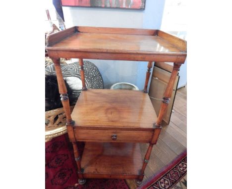 A Victorian mahogany what-not, the three tiers with turned supports, the central tier incorporating a drawer, W. 43cm, togeth