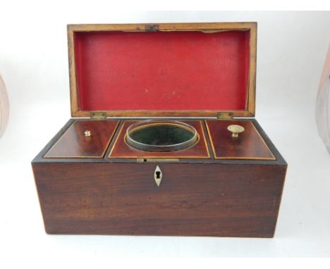 A George III mahogany tea caddy, boxwood strung with twin lidded interior with mixing bowl. W. 30cm