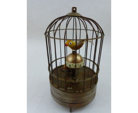 An automaton timepiece, modelled in the form of a pair of caged birds, H. 18cm. 