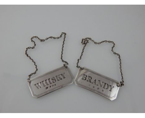 A pair of decanter labels, Birmingham 1988, rectangular with canted corners, marked Brandy & Whisky, 0.6ozt