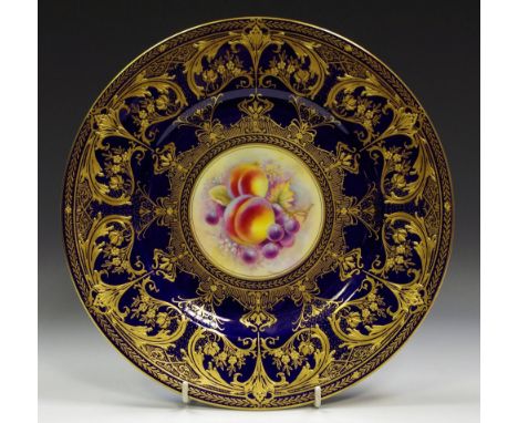 A Royal Worcester cabinet plate cobalt ground, gilded, central panel hand painted by M Morris